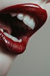 © Fotograf - A close-up view of a woman's lips with bright red lipstick