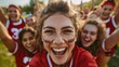 © LukaszDesign - Enthusiastic group of cheerleaders celebrating a sports achievement on the field, showcasing joy, fitness, and happiness in their victorious moment