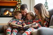 © Michael - Family in matching christmas pajamas gathered around a fireplace reading a story.