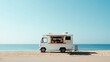 © sa-photo - A food truck parked by the beach, with clear skies and lots of room for text or logo placement.
