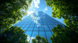 © Siasart Studio - A tall glass skyscraper reflects the blue sky and green trees.