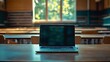 © Generative AI - Laptop on table in empty college classroom : Generative AI