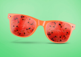 Canvas Print - Sunglasses with juicy watermelon in air on aquamarine background. Summer vibe