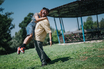 Wall Mural - Two friends enjoying a playful moment outdoors in the park on a sunny day, sharing laughter and joy.