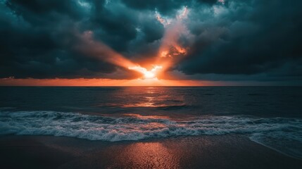 Wall Mural - Dramatic Sunset Over Ocean with Dark Clouds and Waves Crashing on Sandy Beach