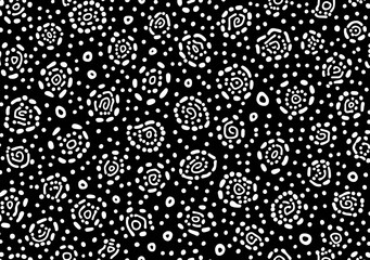 Seamless hand drawn small dense polkadot animal spots pattern in white on black background. Abstract aboriginal dot art motif or organic cellular texture in a trendy doodle line art or linocut style