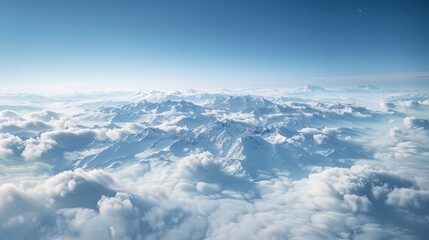 Wall Mural - the serene beauty of aerial clouds over a mountain range, where the peaks rise above the cloud layer