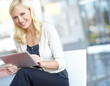 © ReeseBuyout2/peopleimages.com - Woman, happy and tablet in office for portrait, contact and positive feedback for company. Tech, intern and smile in lobby for job opportunity, communication and excited with blog post for update