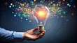 © Four888 - A bright light bulb moment concept, a person's hand connects colorful dots forming a sparkling light trail, symbolizing innovation, idea, and creative insight.
