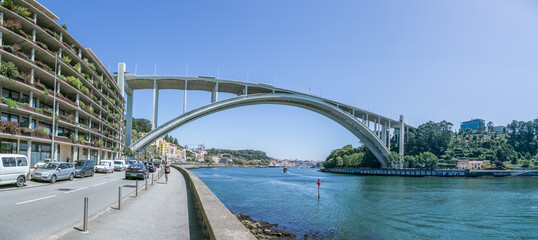 Arrábida Bridge (ponte de Arrábida) and green building with lots of plants, Porto, Portugal, panorama