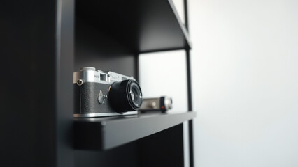 Canvas Print - Vintage camera on a black shelf