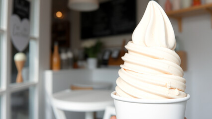 Canvas Print - Close-up of a Soft Serve Ice Cream Cone in a White Cup