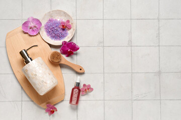 Wall Mural - Beautiful spa composition with orchid flowers on light tile background