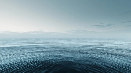 Wall Mural - Calm ocean horizon with soft ripples under a pale blue sky, evoking peace and tranquility.

