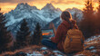 © 沈军 贡 - A woman sits on the ground with her back to us, working on an open laptop in front of her and gazing into the distance where a snow-covered mountain landscape lies.