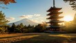 © trimiati - A beautiful photo of the Chureito Pagoda in Fujiyoshida, Japan, with the sun setting behind it and Mount Fuji visible in the distance