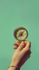 a clear image of a hand holding a compass pointing north against a green backdrop symbolizes guidanc