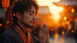 © irina - A contemplative man in traditional attire prays during sunset in an ancient city filled with warm light and cultural richness