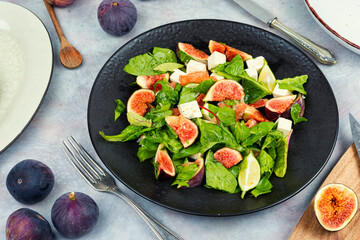 Canvas Print - Plate of fresh salad with figs