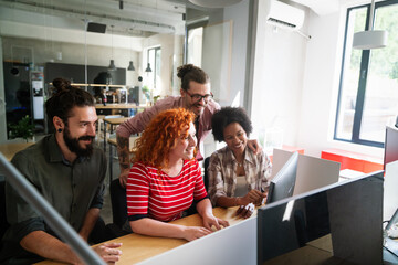 Mixed team of software engineers brainstorming ideas. Diverse app developers collaborating as group