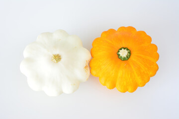 white and yellow pattypan squashes isolated on white background