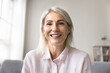 © fizkes - Video call participant profile picture. Head shot portrait middle-aged 50s female on-line tutor or counsellor smile look at camera, engage in videoconference by work or personal. Virtual meeting event