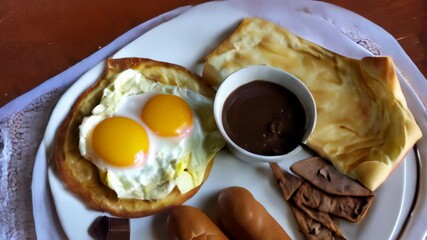 Wall Mural -  Delicious breakfast spread with eggs bread and dipping sauce