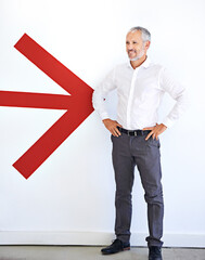 Poster - Arrow, thinking and mature businessman in office with confidence, pride and job on white background. Professional, corporate and happy person with symbol for company growth, direction and pointing