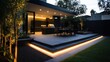 © BerkahStock - Modern Backyard Patio with Warm Lighting