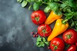 © StockUp - A collection of fresh and vibrant vegetables, featuring tomatoes, yellow peppers, and greens on a dark surface.
