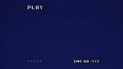 Retro video screen displaying PLAY text in pixelated white font against a deep blue background. Date placeholder MM-DD-YY and time indicator visible, evoking nostalgic gaming or VCR interface.
