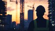 © arhendrix - Silhouette of a construction worker with cranes and buildings in the background at sunset, showcasing urban development and industry.