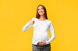 © Prostock-studio - Happy Pregnancy. Cheerful Pregnant Woman Gesturing Thumbs-Up Posing Over Pink Studio Background.
