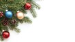 © Heng Heng - AI Stock - Elegant and Festive Decorated Christmas Tree Branch with Ornaments Tinsel and Sparkles Isolated on a Clean White Background with Copy Space for Seasonal Greetings or Product Display