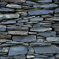 Wall Mural - Textured slate stone wall with varying sizes and shades of gray