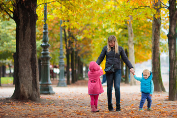 Wall Mural - Mother and baby in autumn. Fall outdoor family fun.