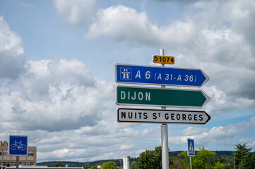 Driving in summer on  road,  signs direction to Dijon, Beaune and other French cities, different types or roads in France, transportation and traffic