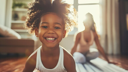 Wall Mural - A close-up photograph of a child in a playful yoga pose with a mother in the background, both smiling