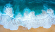 © MstAfrin - Aerial view of the ocean waves and sandy beach, with turquoise water and white foam
