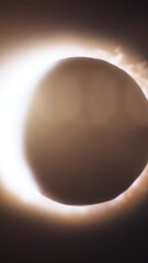 Wall Mural - abstract animation of eclipse of sun. moon closes sun leaving ring of fire on black background. anim