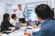 © Summit Art Creations - Presentation in office or meeting room with analyst team utilizing BI Fintech to analyze financial data. Businesspeople analyzing BI dashboard power display on TV screen for strategic planning.Prudent
