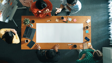 Wall Mural - Top view of diverse group walking at boardroom and brainstorming idea. Smart startup team sharing marketing idea while project manager standing at whiteboard and present financial plan. Convocation.