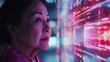 © CYBERPINK - A woman is looking at a computer screen with a lot of numbers and symbols