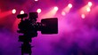 © GenBy - Professional video camera on tripod against vibrant stage lights background, perfect for media productions and events. Captivating visual setup.