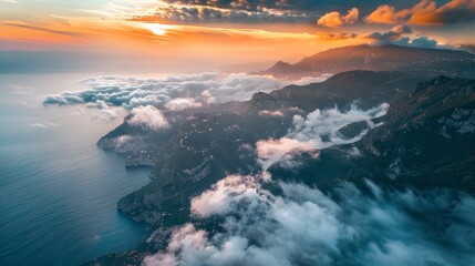 Sticker - Aerial view of mountain range surrounded by low clouds at sunset and the Amalfi Coast in background as seen from the plane, Salerno, Campania, Italy. 