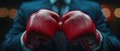 © WrongWay - closeup punch of cropped businessman man in boxing gloves