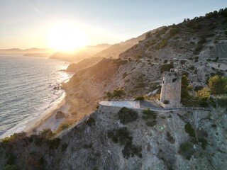 Picturesque Torre de Maro perched on the cliffs, offering a panoramic view of the Mediterranean coastline