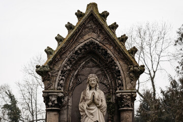 Virgin Mary in prayer on the background of a chapel in the Gothic style.  (the concept of faith, death)