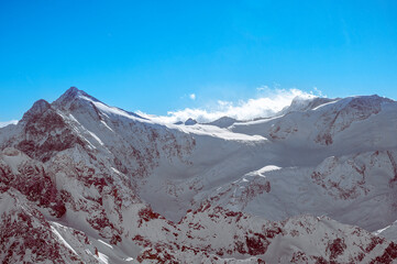 The great view of the Titlis: The rugged beauty of the Swiss Alps shines in a majestic landscape of snow-capped peaks, from the lofty mountain top