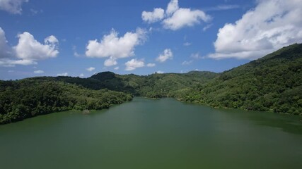 Sticker - Aerial view on a lake among mountain in the area of the dam. Landscape of Green canyon blue sky white clouds, Aerial view 4K high quality video footage